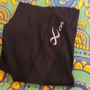 Cwx leggings large with tiny pocket black in color, large, not full length.
